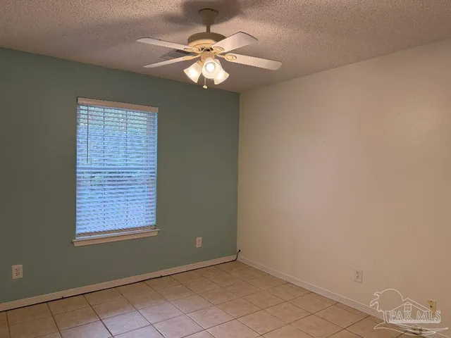 a view of an empty room with windows