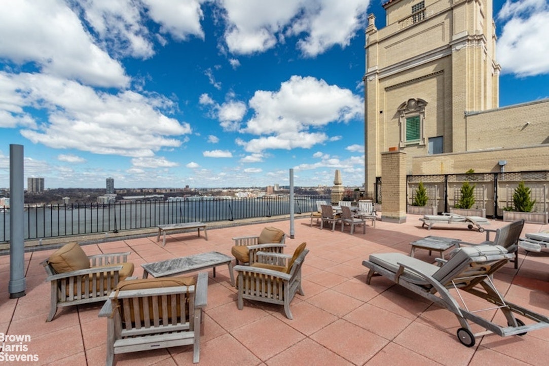 140 Riverside Drive, Unit 5K Manhattan, NY 10024 - Photo 11 of 16 a terrace with outdoor seating and city view