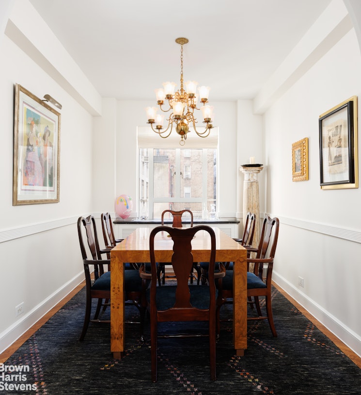 140 Riverside Drive, Unit 5K Manhattan, NY 10024 - Photo 5 of 16 a view of a dining room with furniture a chandelier and wooden floor