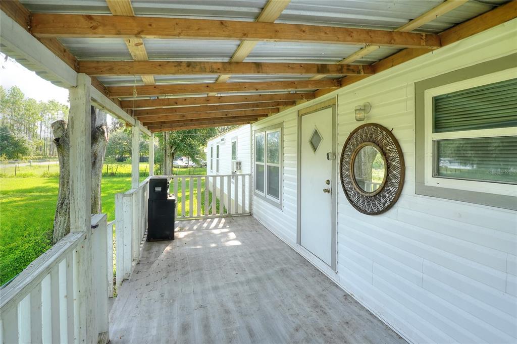 12552 Farmettes Road Lakeland, FL 33809 - Photo 21 of 43 a view of a pathway of a house with a porch
