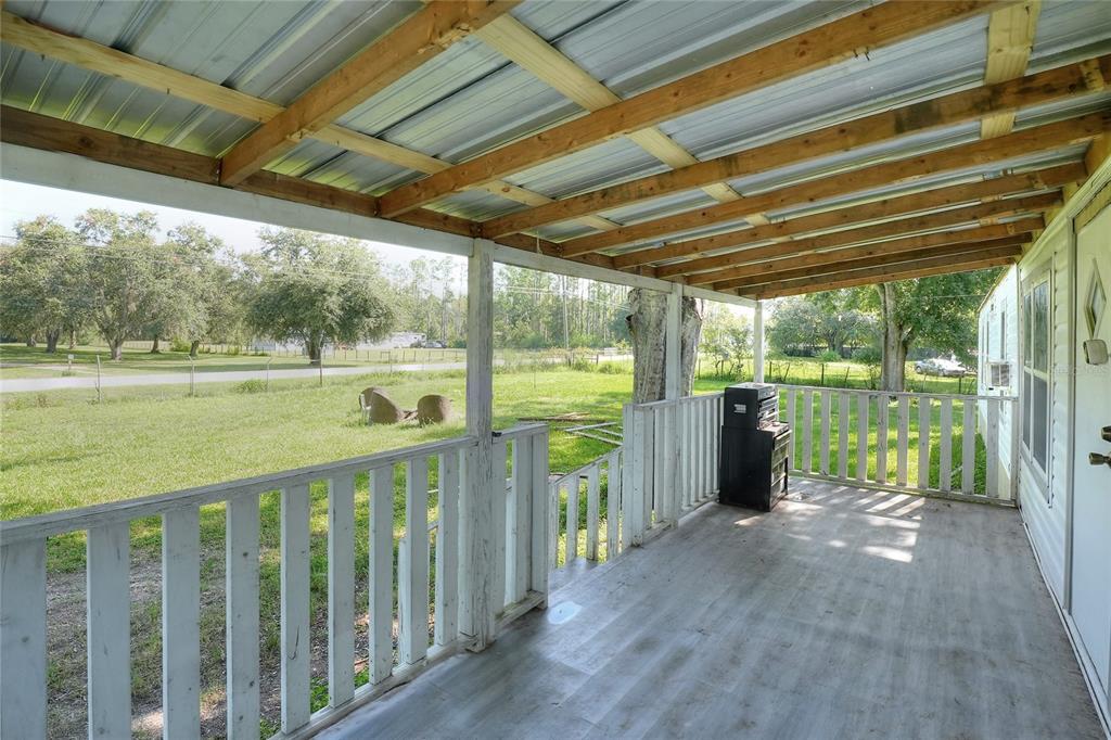 12552 Farmettes Road Lakeland, FL 33809 - Photo 23 of 43 a view of a outdoor space with wooden floor and outdoor space