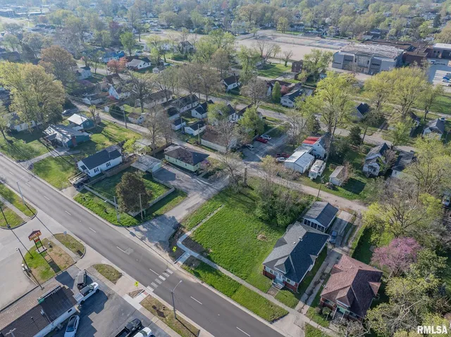 an aerial view of a house with a garden