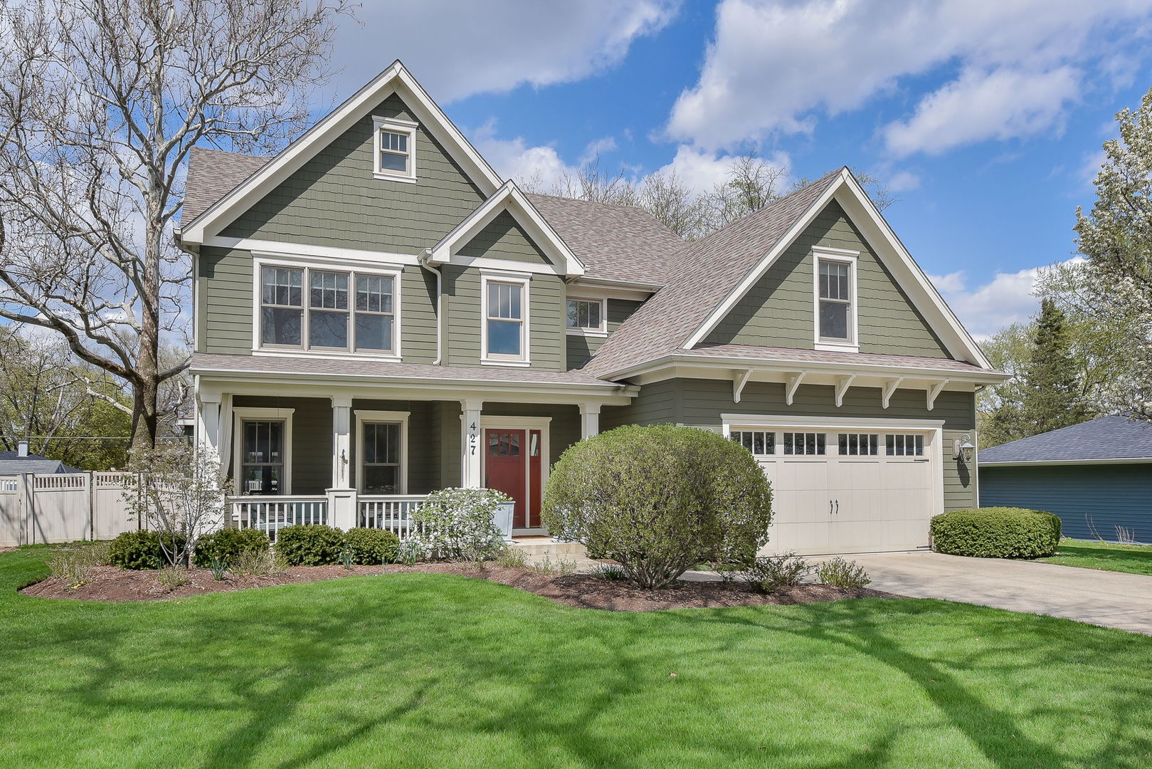 427 Ranch Road Wheaton, IL 60187 - Photo 1 of 38 a front view of a house with a yard