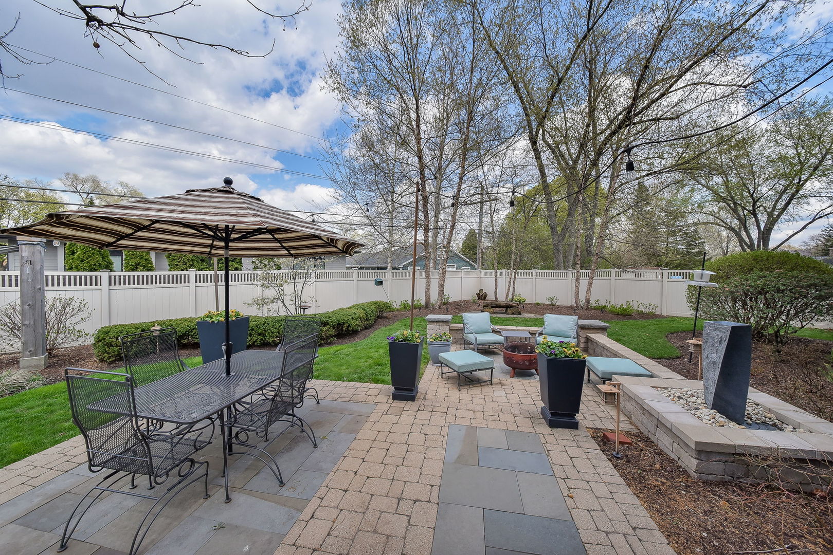 427 Ranch Road Wheaton, IL 60187 - Photo 33 of 38 a view of a patio with couches a table and chairs