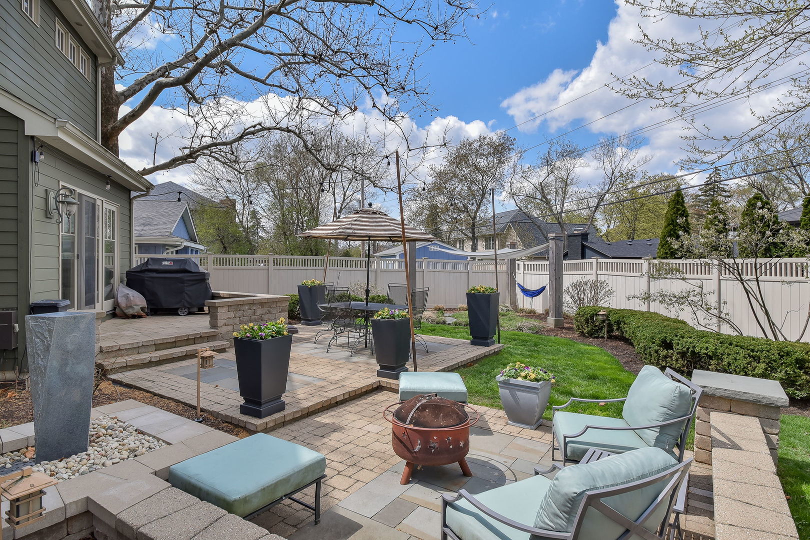427 Ranch Road Wheaton, IL 60187 - Photo 34 of 38 a view of a patio with couches table and chairs and potted plants
