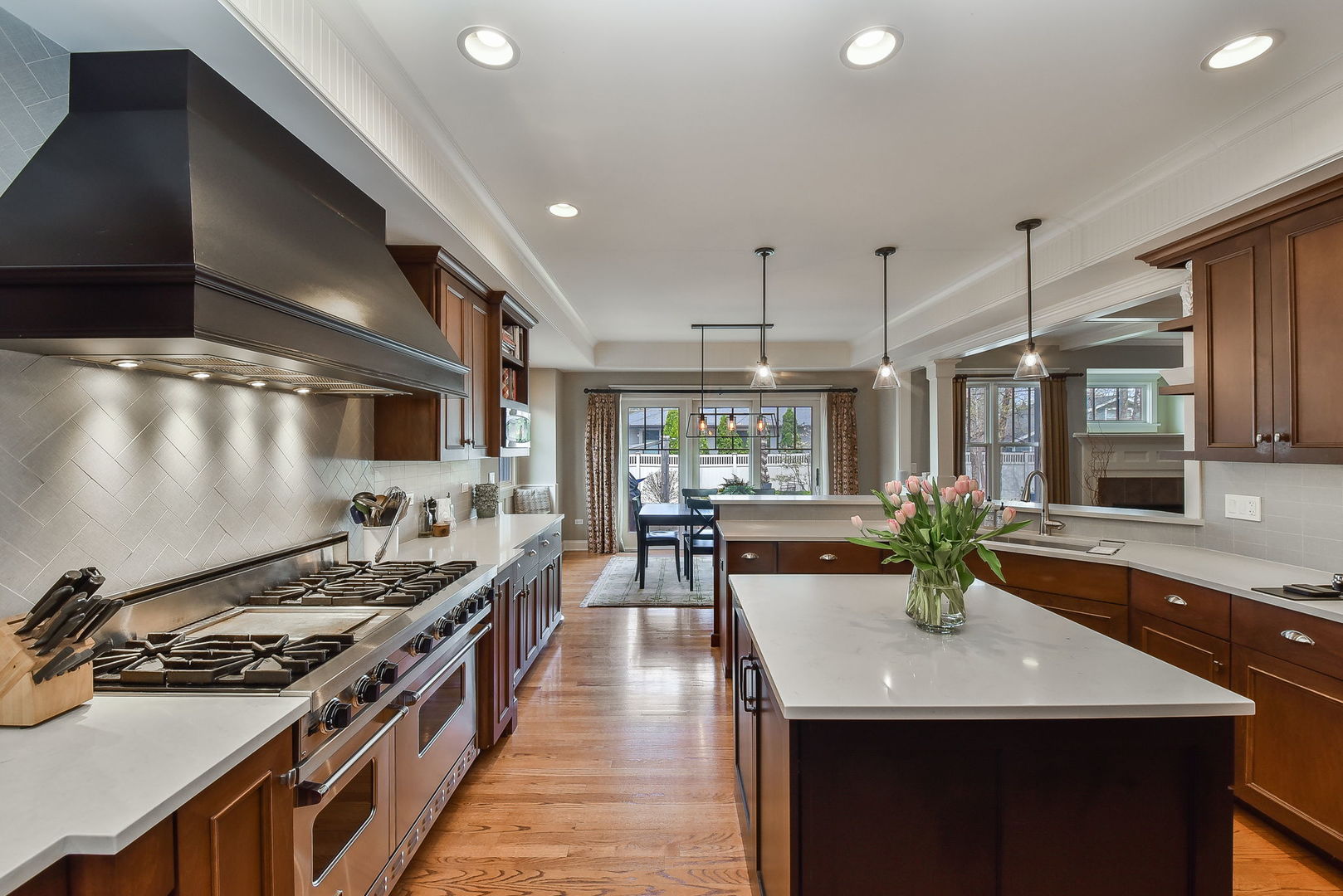 427 Ranch Road Wheaton, IL 60187 - Photo 4 of 38 a kitchen with lots of counter top space and wooden floor