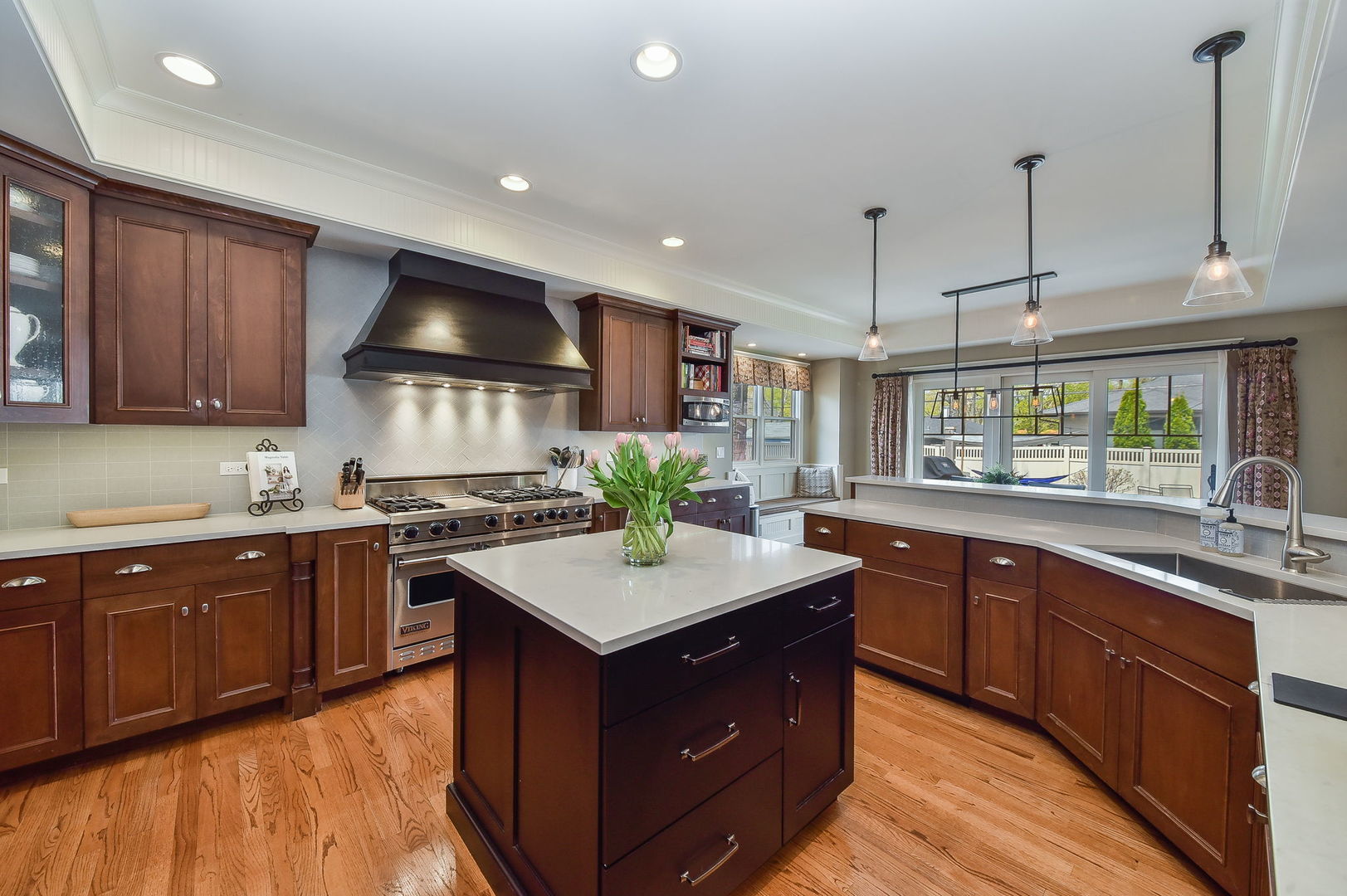 427 Ranch Road Wheaton, IL 60187 - Photo 7 of 38 a kitchen with a sink stove and cabinets