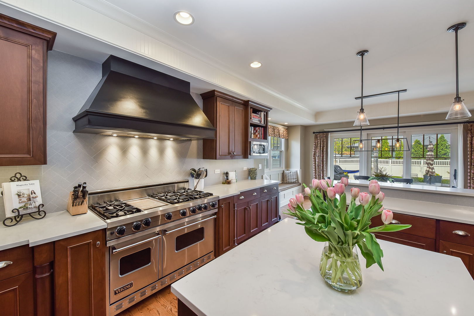 427 Ranch Road Wheaton, IL 60187 - Photo 8 of 38 a kitchen with a stove a sink and a potted plant