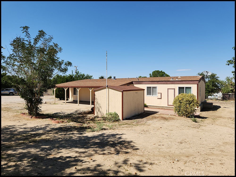 11037 Oasis Road Pinon Hills, CA 92372 - Photo 1 of 1 a view of a house with a yard