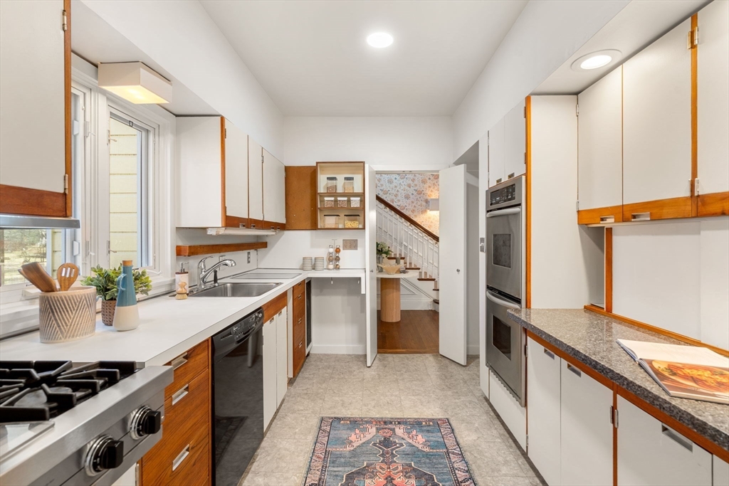 1066 Walnut Street Newton, MA 02461 - Photo 13 of 37 a kitchen with a sink stove and refrigerator