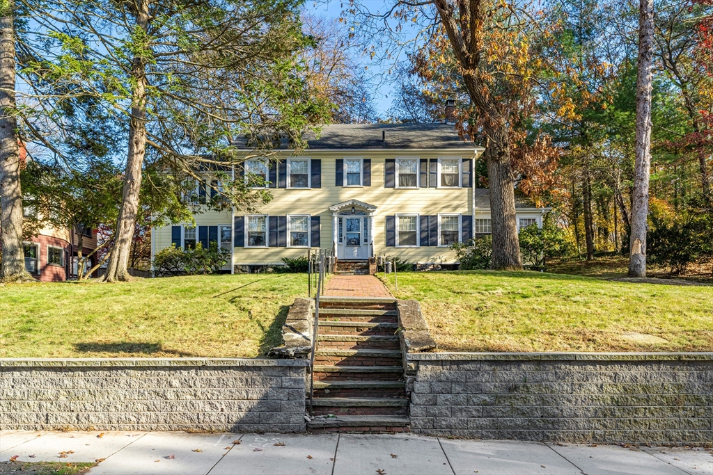 1066 Walnut Street Newton, MA 02461 - Photo 27 of 37 a front view of a house with a yard