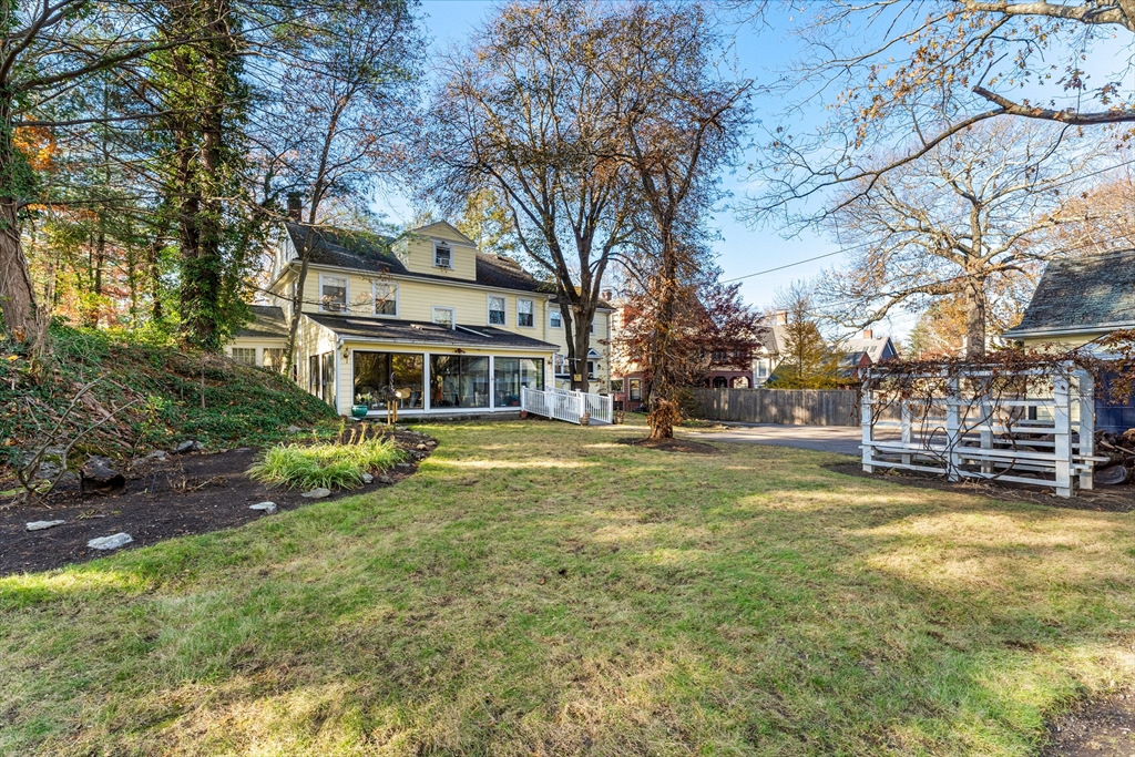 1066 Walnut Street Newton, MA 02461 - Photo 32 of 37 a front view of a house with a big yard
