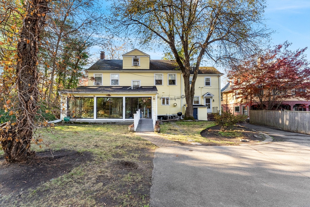 1066 Walnut Street Newton, MA 02461 - Photo 34 of 37 a view of a house with a yard and large tree
