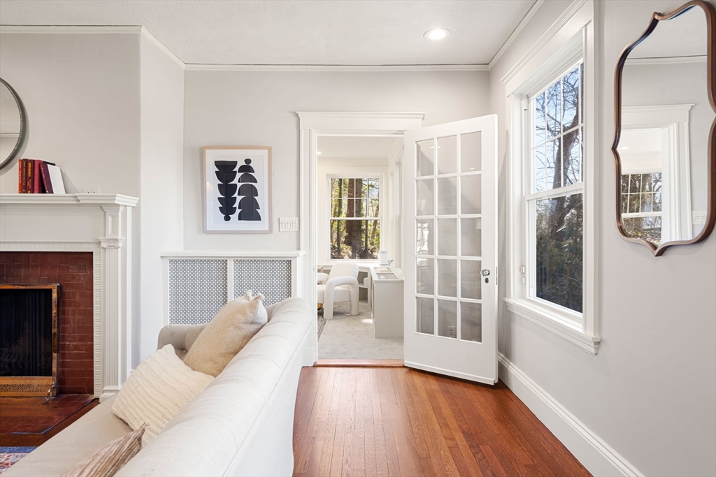 1066 Walnut Street Newton, MA 02461 - Photo 7 of 37 a living room with furniture and a fireplace