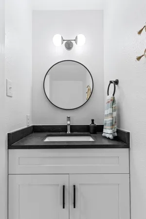 a bathroom with a sink and a mirror