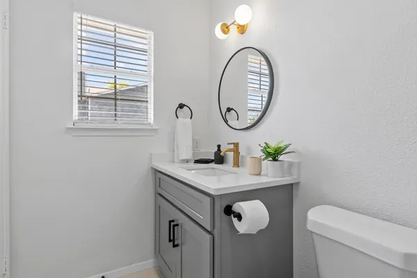 a bathroom with a toilet and a sink