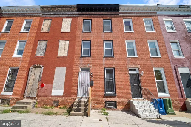 a front view of a building with a street