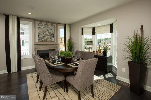 7682 Elmcrest Road Hanover, MD 21076 - Photo 2 of 21 a dining room with furniture window and wooden floor