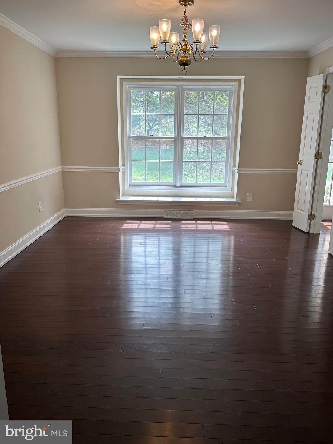 418 Waynesbrooke Road Berwyn, PA 19312 - Photo 11 of 30 a view of an empty room with wooden floor and a window
