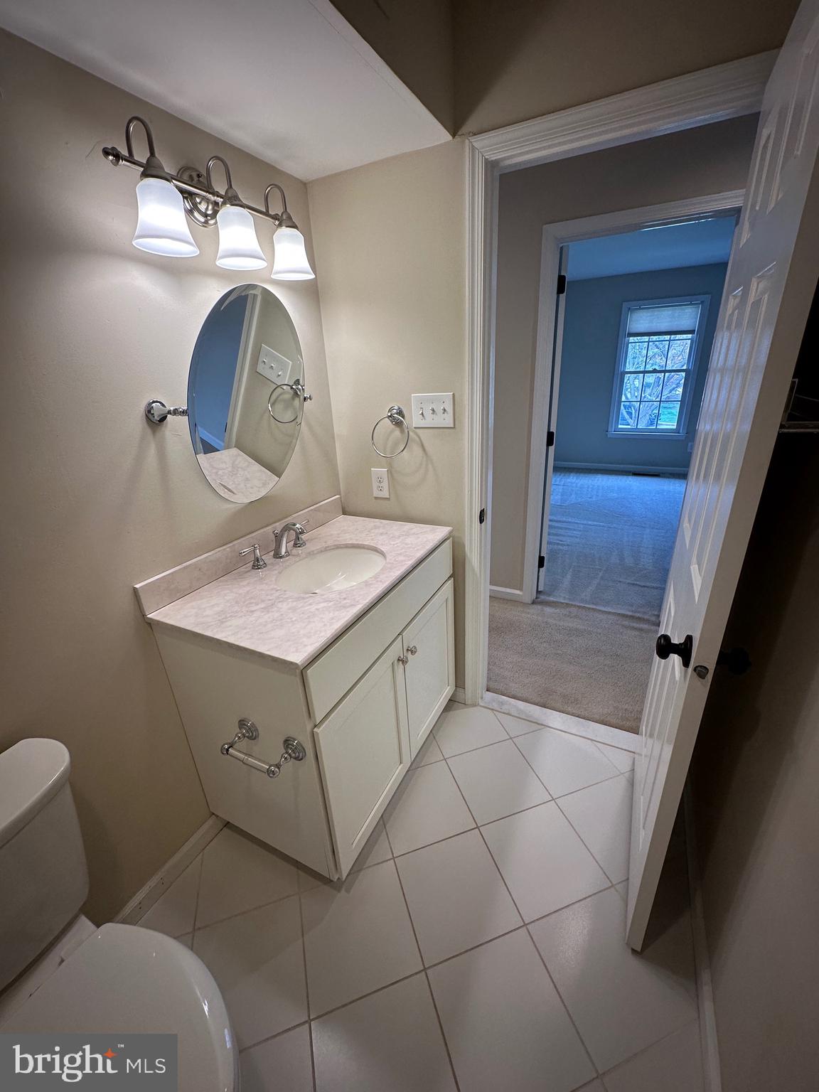 418 Waynesbrooke Road Berwyn, PA 19312 - Photo 26 of 30 a bathroom with a sink a toilet and mirror