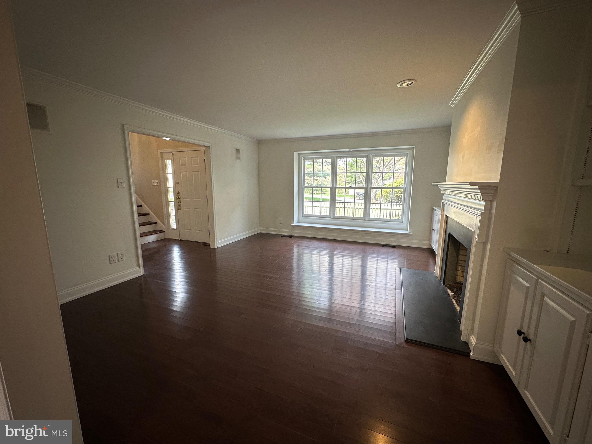 418 Waynesbrooke Road Berwyn, PA 19312 - Photo 6 of 30 an empty room with wooden floor and a window