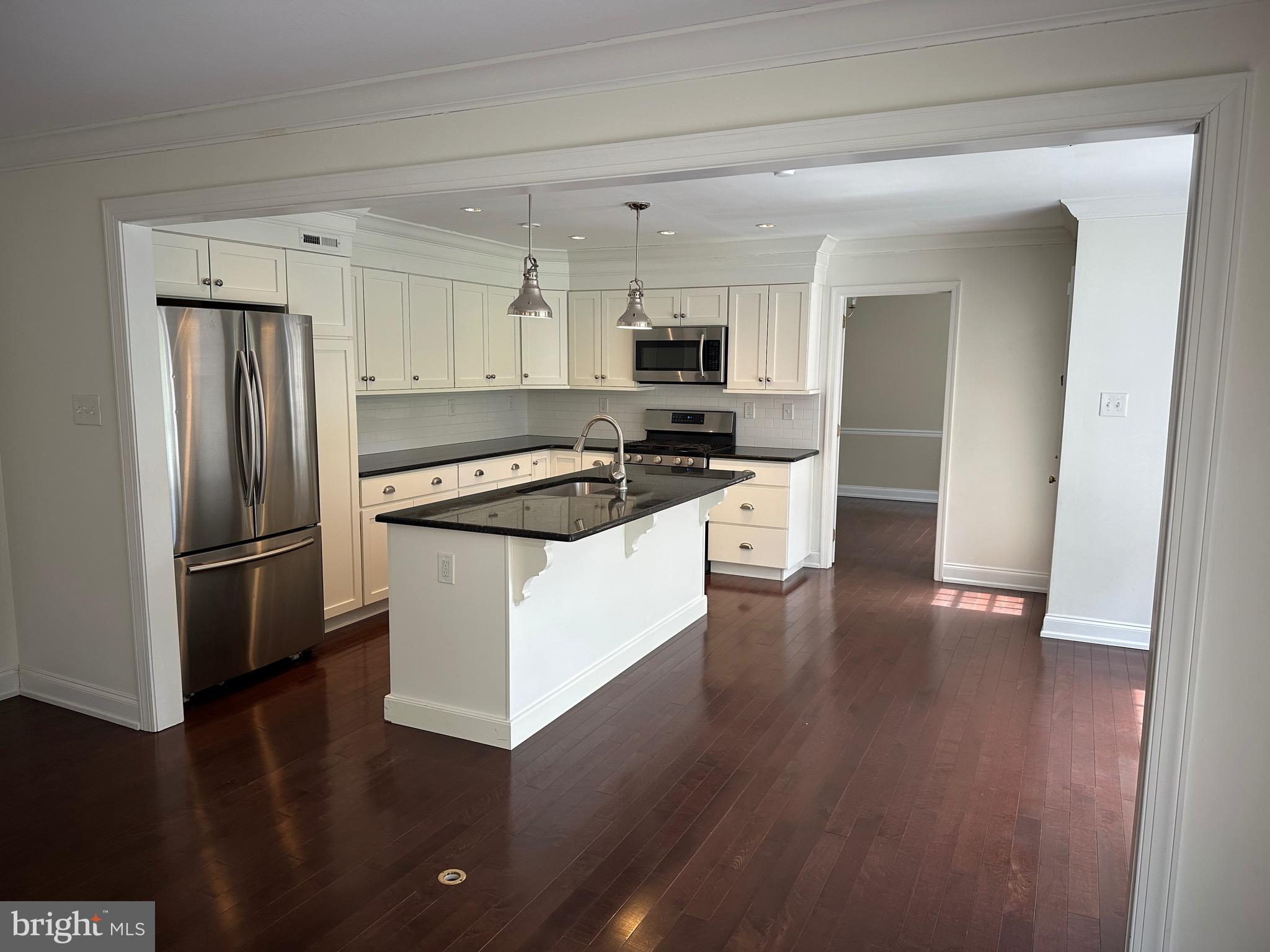 418 Waynesbrooke Road Berwyn, PA 19312 - Photo 8 of 30 a kitchen with stainless steel appliances a refrigerator a stove a sink and white cabinets