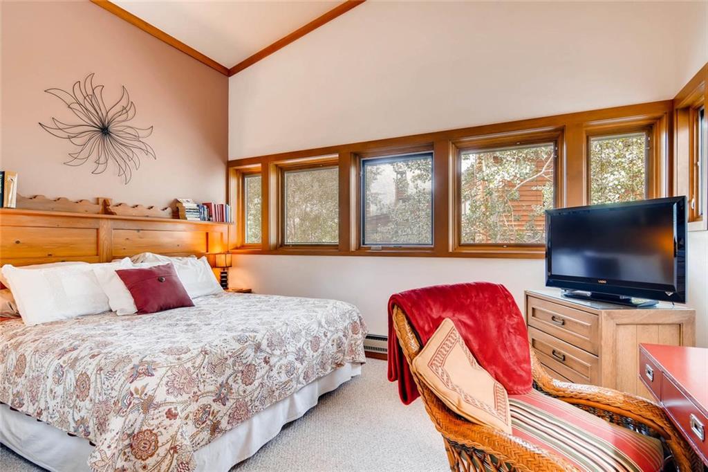 650 Tennis Club Road, Unit 1340 Keystone, CO 80435 - Photo 13 of 25 a bedroom with a bed and glass window