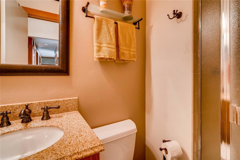 650 Tennis Club Road, Unit 1340 Keystone, CO 80435 - Photo 16 of 25 a bathroom with a sink toilet and shower