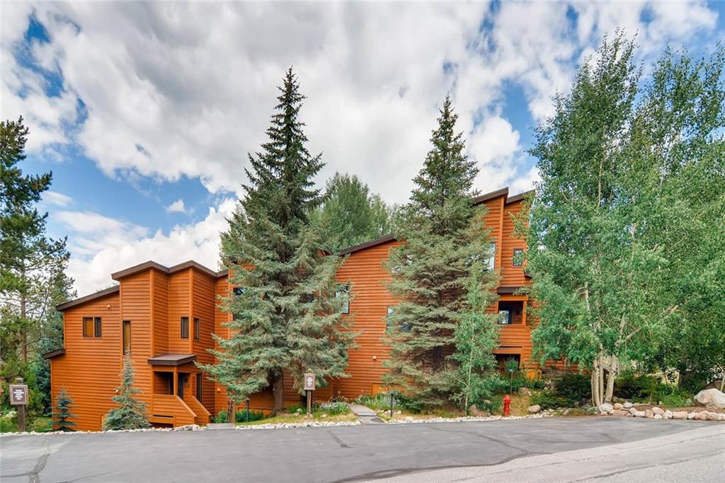 650 Tennis Club Road, Unit 1340 Keystone, CO 80435 - Photo 19 of 25 a front view of a house with a yard and trees