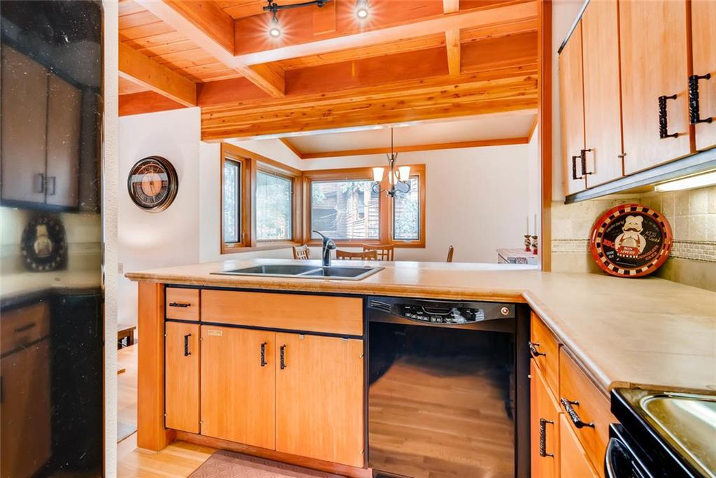 650 Tennis Club Road, Unit 1340 Keystone, CO 80435 - Photo 4 of 25 a kitchen with stainless steel appliances granite countertop a sink and cabinets