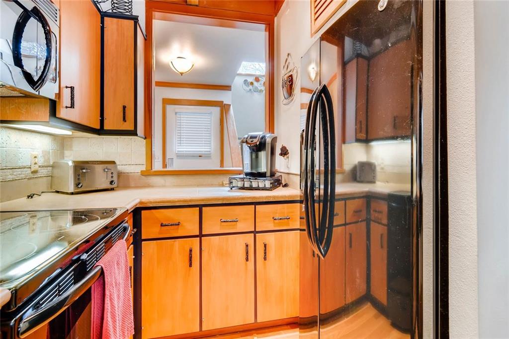 650 Tennis Club Road, Unit 1340 Keystone, CO 80435 - Photo 6 of 25 a kitchen with stainless steel appliances granite countertop a sink and cabinets