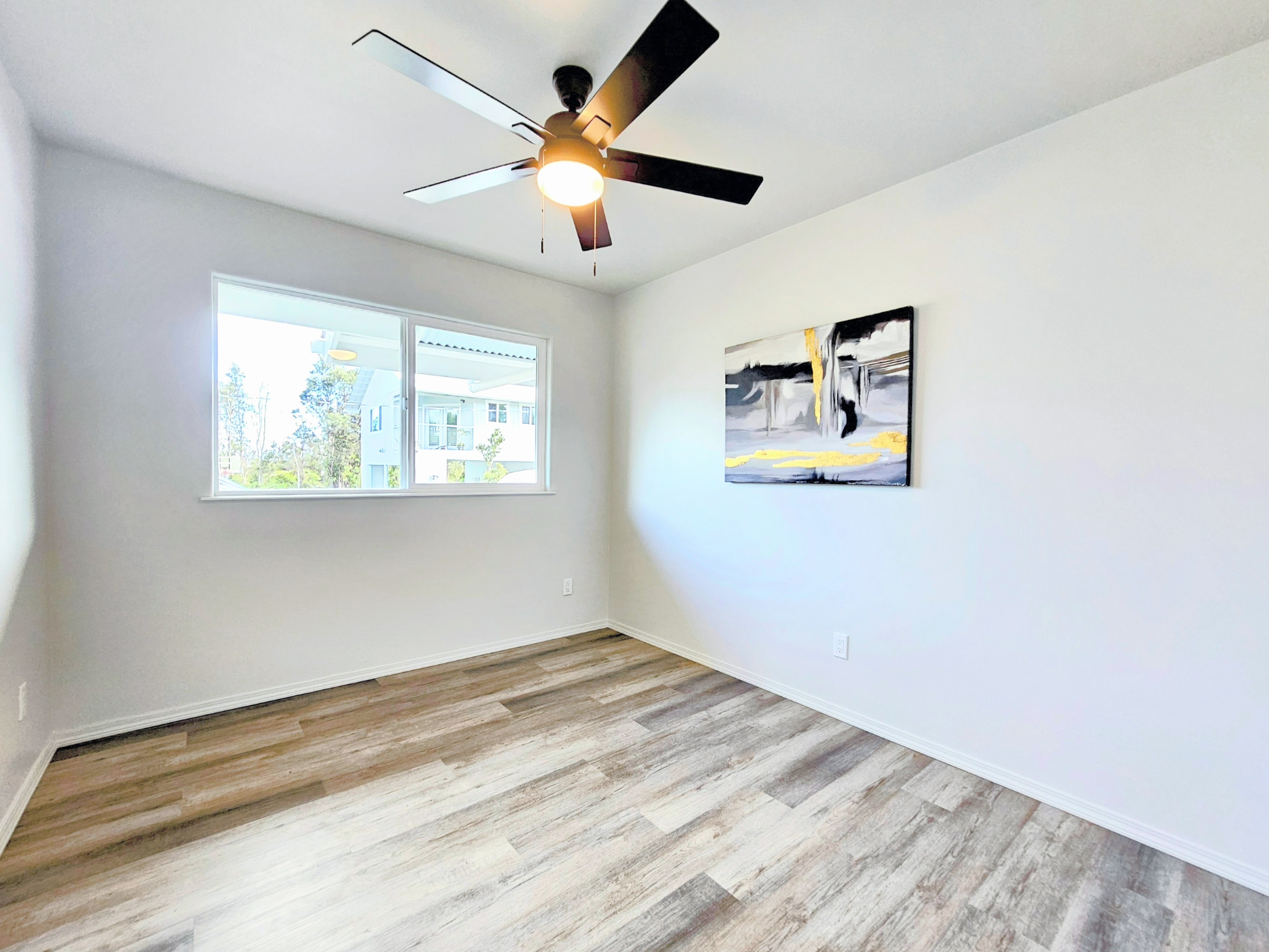 11-3385 Old Volcano Road Volcano, HI 96785 - Photo 17 of 30 wooden floor in an empty room with a window