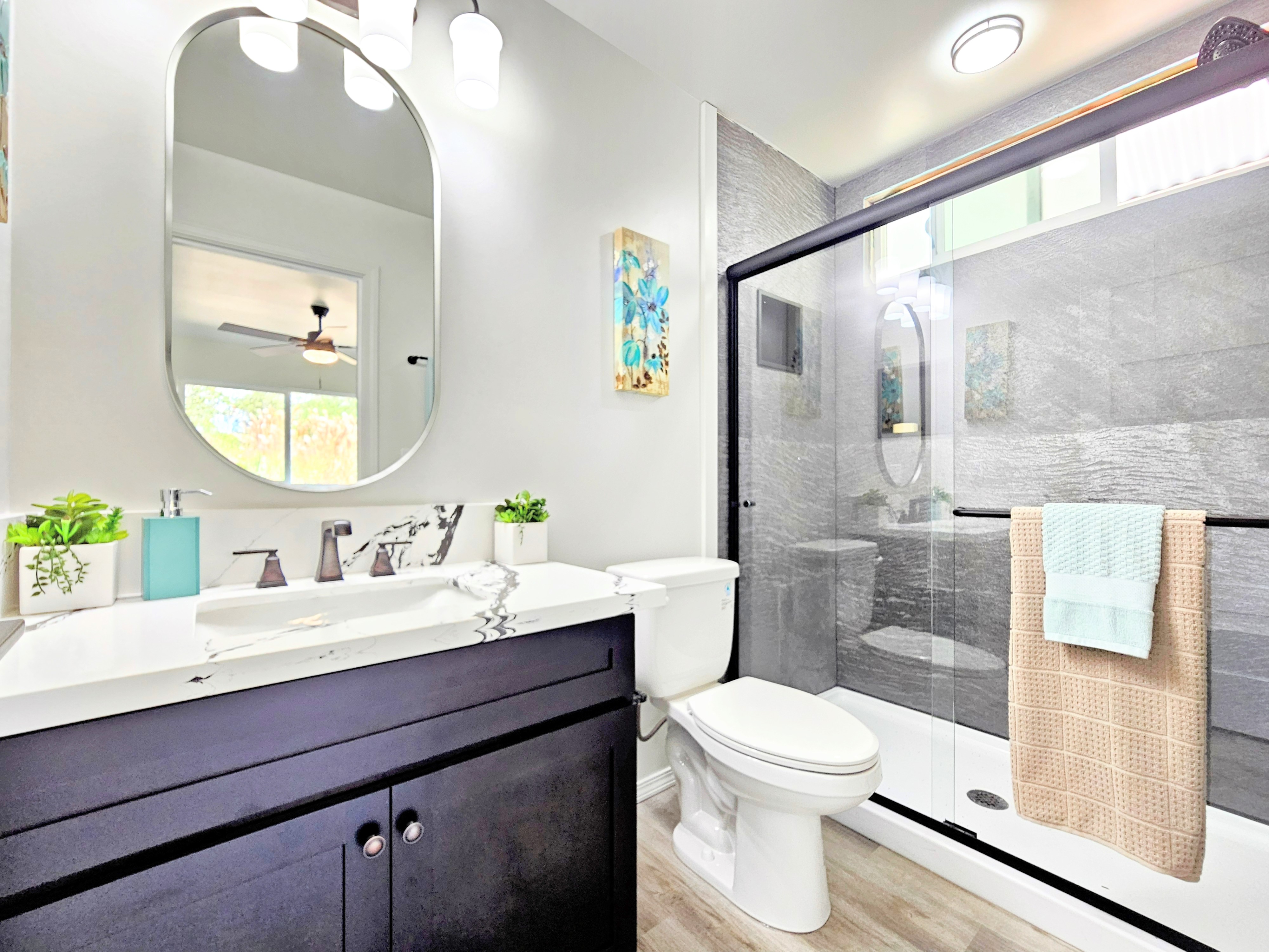 11-3385 Old Volcano Road Volcano, HI 96785 - Photo 22 of 30 a bathroom with a toilet a sink a mirror and a shower