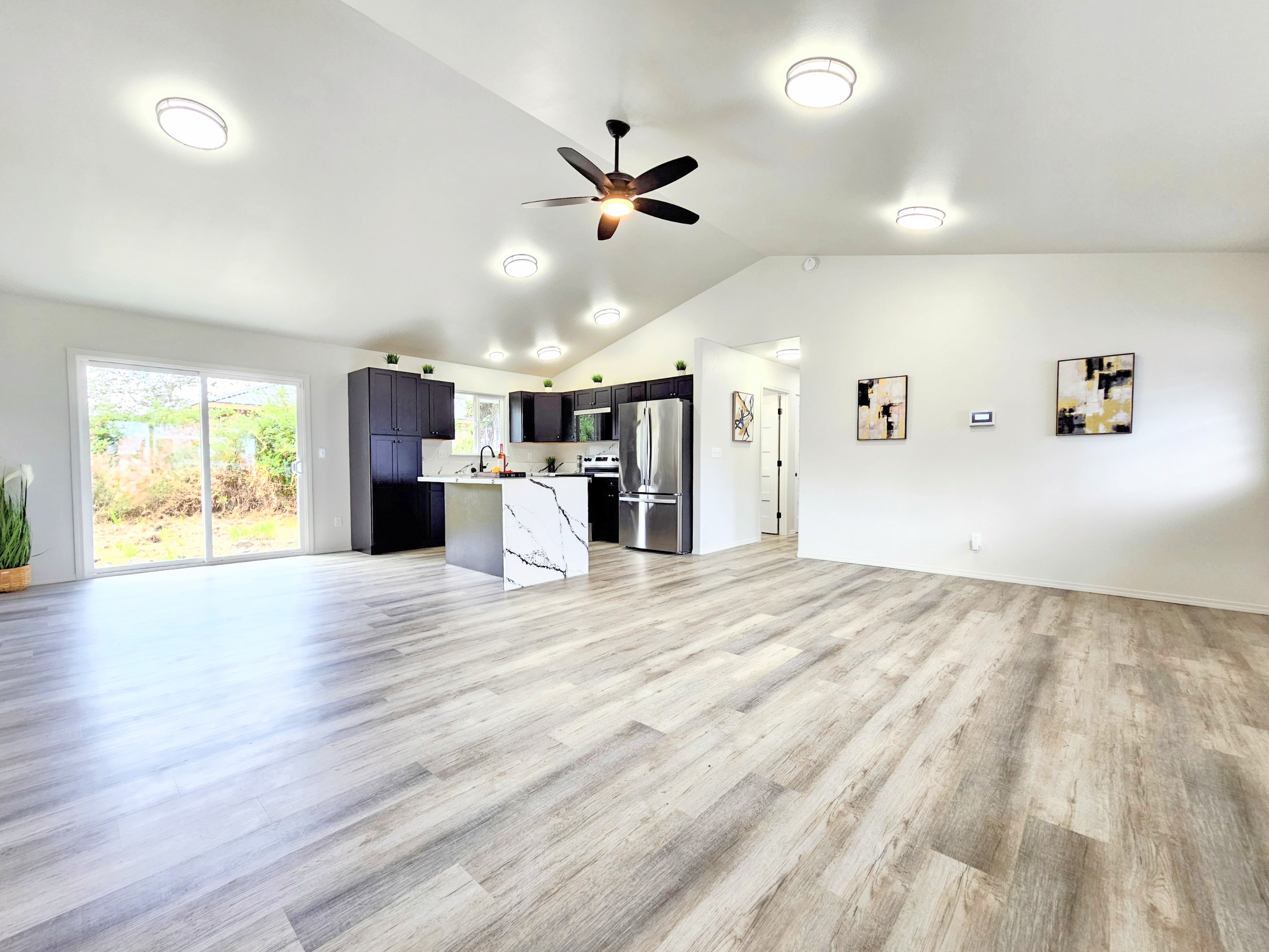 11-3385 Old Volcano Road Volcano, HI 96785 - Photo 6 of 30 a view of empty room with wooden floor and fan