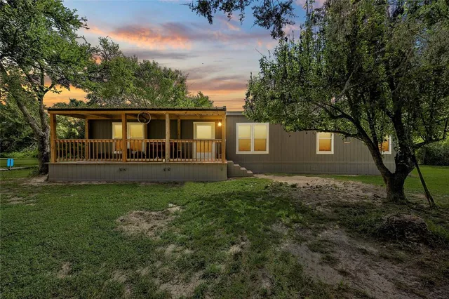 a house view with a garden space