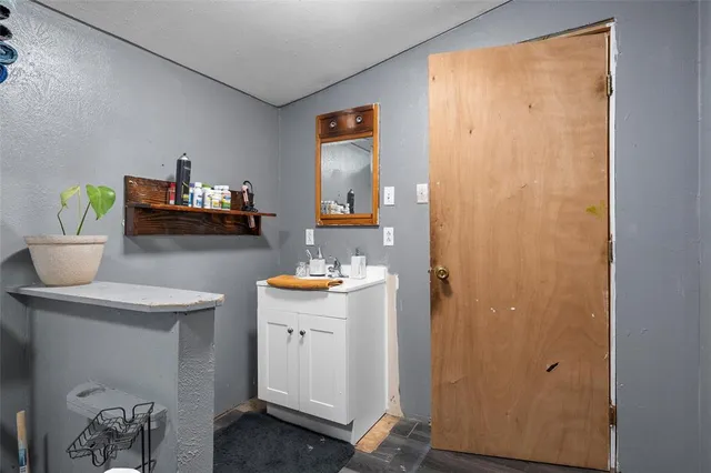 a view of living room and workspace