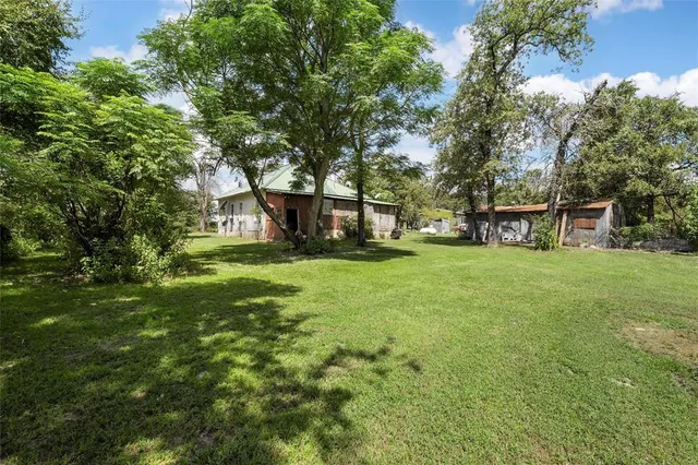a view of house with garden