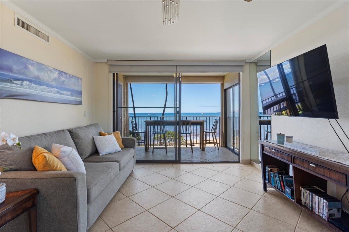 36 South Kihei Road, Unit 301 Kihei, HI 96753 - Photo 2 of 30 a living room with furniture and a flat screen tv