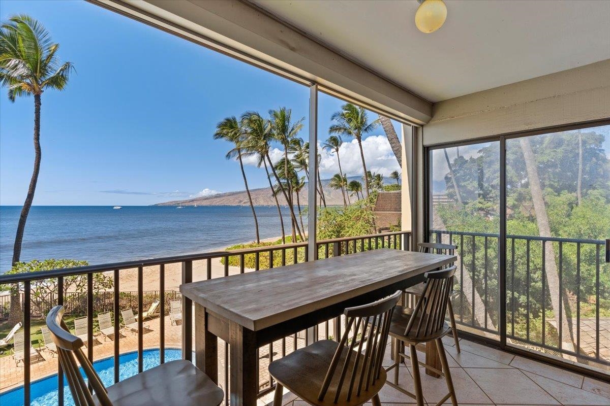 36 South Kihei Road, Unit 301 Kihei, HI 96753 - Photo 6 of 30 a view of a patio with a table chairs and a potted plant