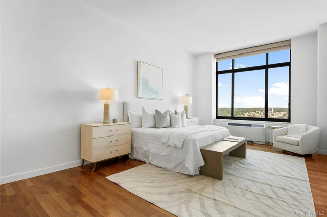 a bathroom with a double vanity sink and mirror with toilet