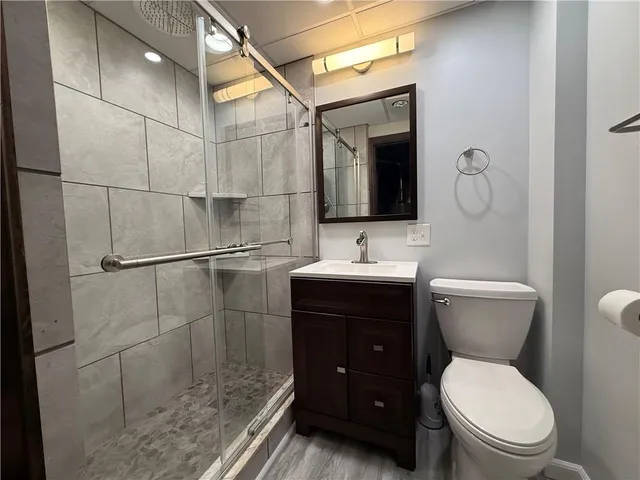 a view of a room with wooden floor