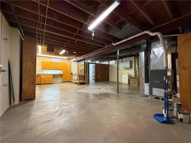 a view of an empty room with a fireplace