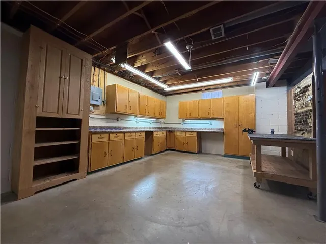 a view of a room with wooden walls