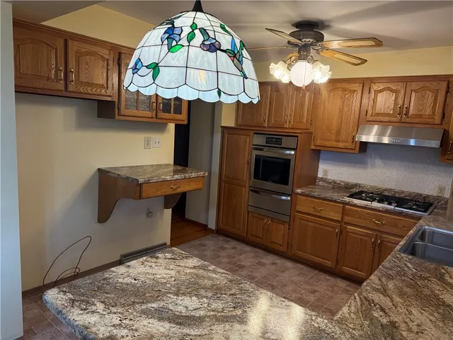 a room with natural light and wooden floor