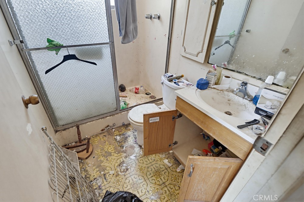 736 Sacramento Avenue Spring Valley, CA 91977 - Photo 21 of 33 a bathroom with a sink and mirror with bathtub