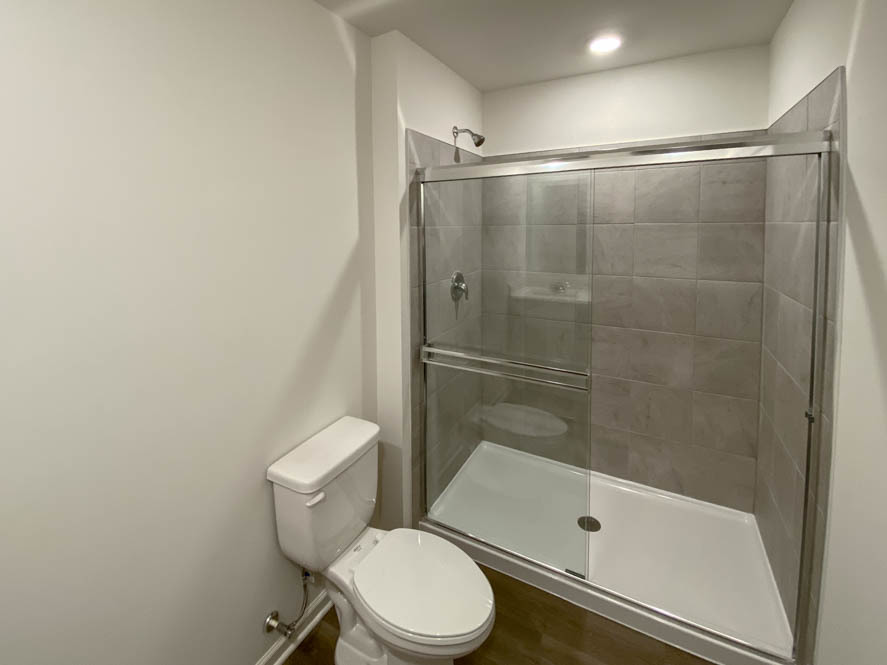 577 Yosemite Way Mundelein, IL 60060 - Photo 14 of 42 a bathroom with a toilet and a shower