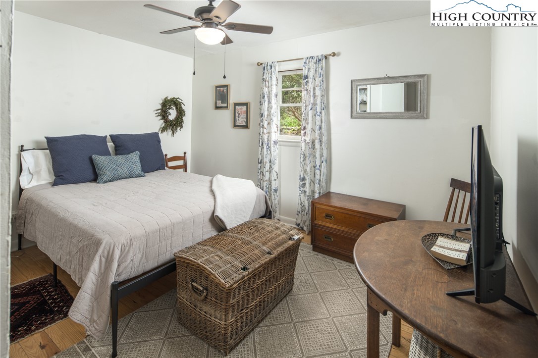 190 Bradley Court Boone, NC 28607 - Photo 11 of 28 a bedroom with a bed and ceiling fan