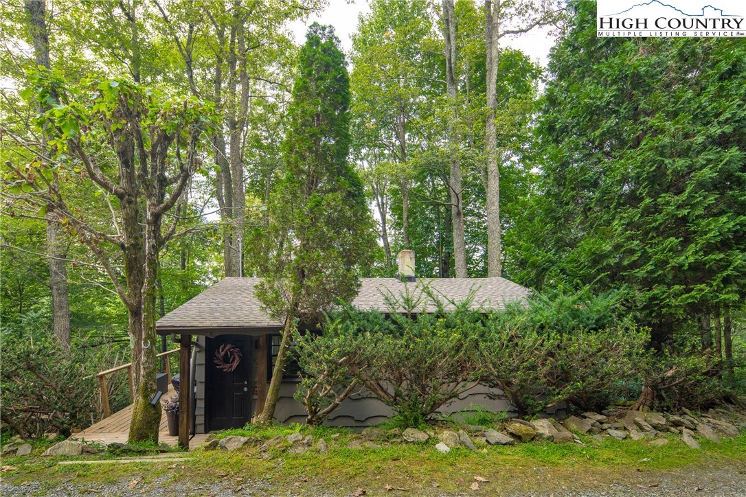 190 Bradley Court Boone, NC 28607 - Photo 26 of 28 a view of a garden with a bench and trees