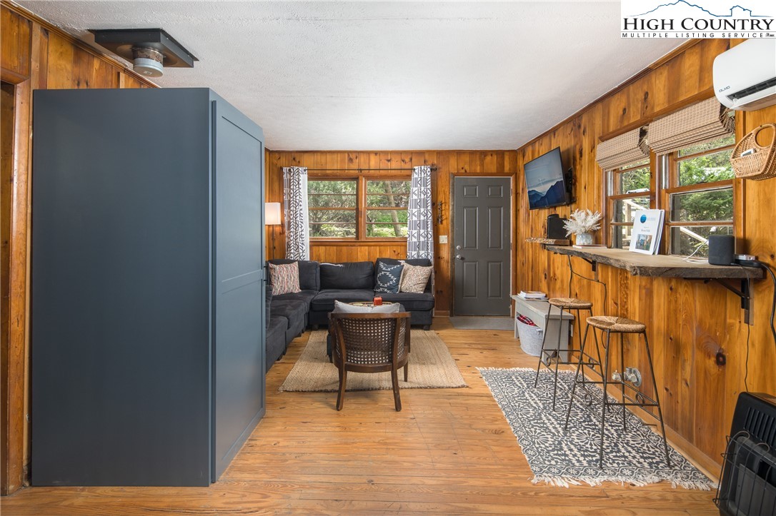190 Bradley Court Boone, NC 28607 - Photo 6 of 28 a living room with furniture and a floor to ceiling window