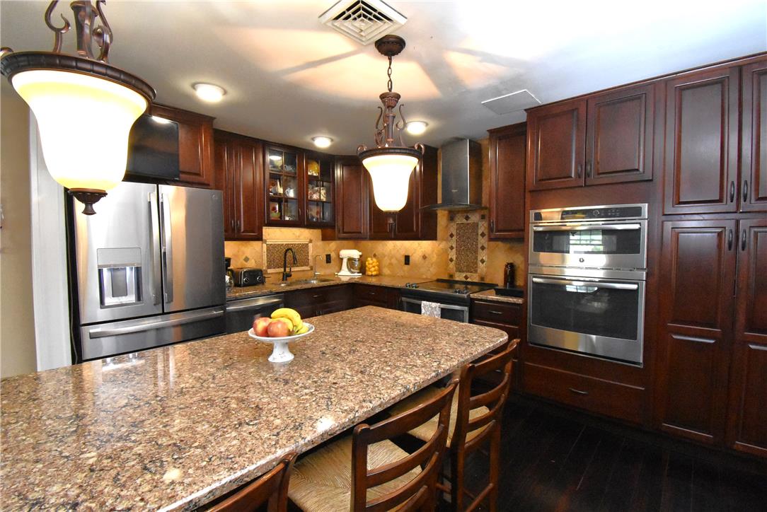 424 Grape Street Whitehall, PA 18052 - Photo 13 of 50 This chef's kitchen features stainless steel appliances and abundant cabinetry, perfect for culinary adventures.